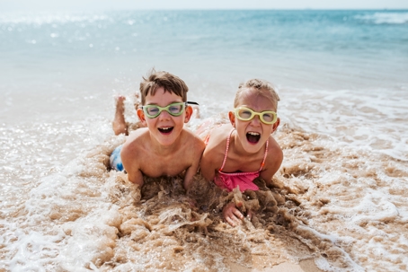 children playing on the beach
