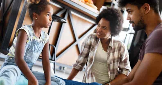 parents talking to daughter