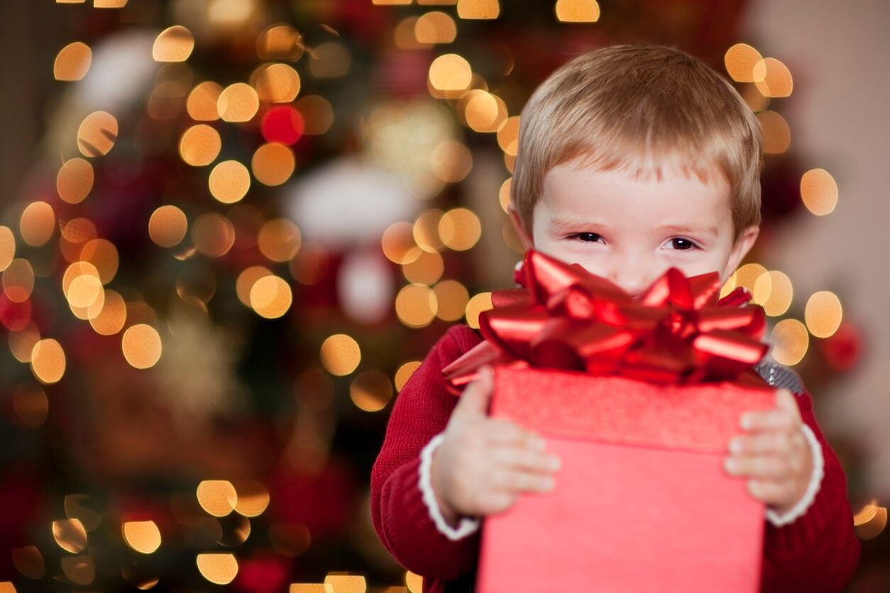 Young Boy Smiles with his Christmas Present