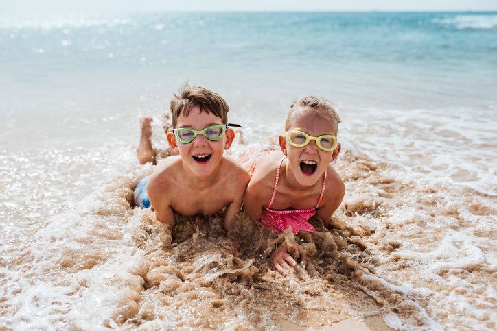 children playing on the beach