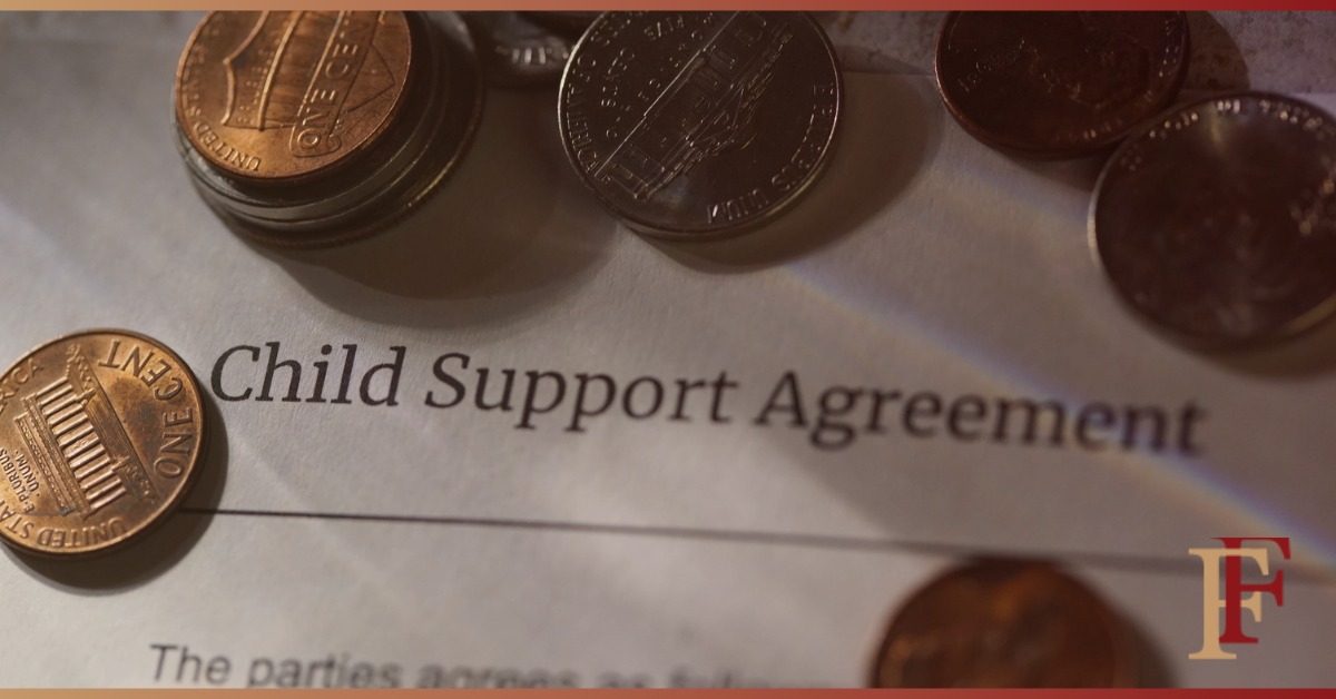 money and paper that says child support agreement