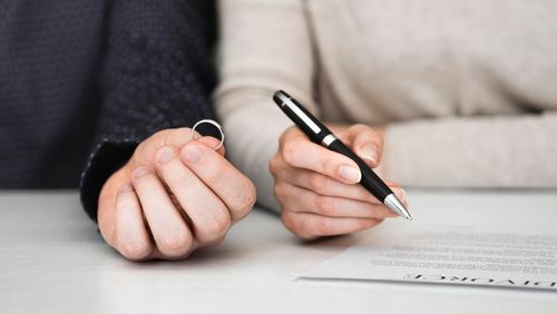 couple signing separation agreement