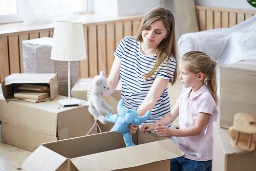 mother and daughter unpacking